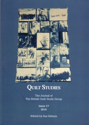 Booklet with blue and white pictorial images on quilt