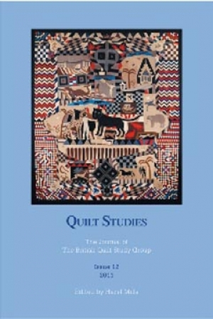 Booklet with pictorial quilt on blue background