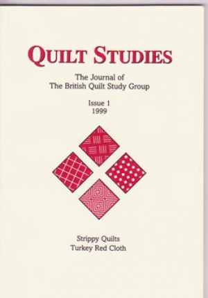 Booklet with four red diamonds on cream background