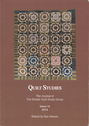 Booklet with traditional quilt on brown background