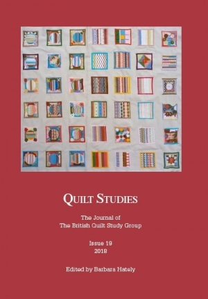 Booklet with brightly coloured patchwork on red background