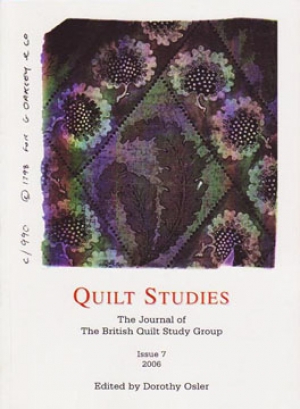 Booklet with purple floral fabric on white background