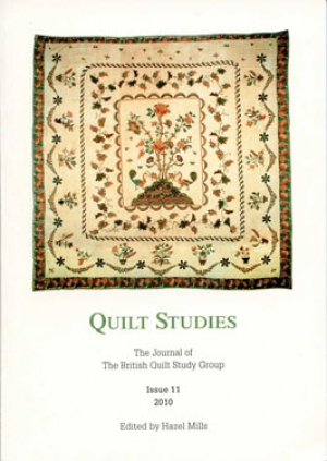 Booklet with applique frame quilt on white background