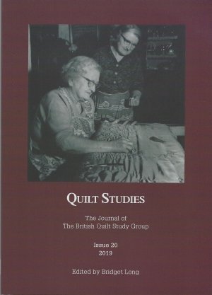 Booklet with elderly woman hand quilting watched by another woman