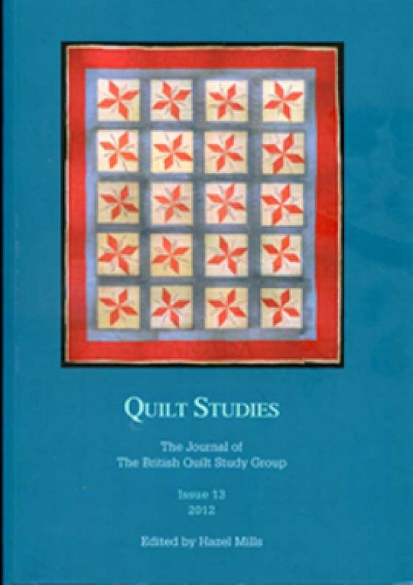 Booklet with red star quilt on blue background