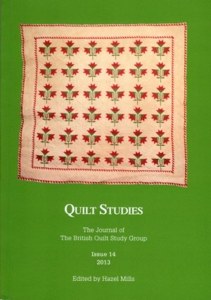 Booklet with floral quilt on green background