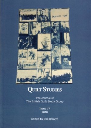 Booklet with blue and white pictorial images on quilt