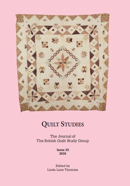 Brown and Pink applique and patchwork frame quilt on pink background