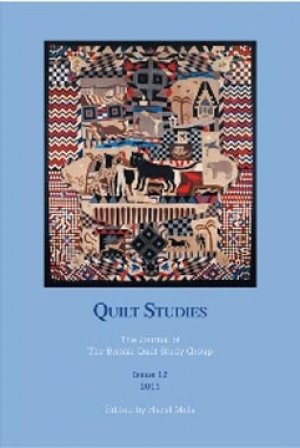 Booklet with pictorial quilt on blue background
