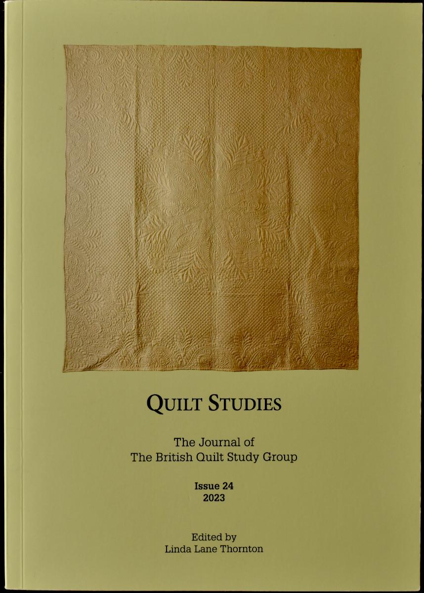 Green booklet with cream quilt