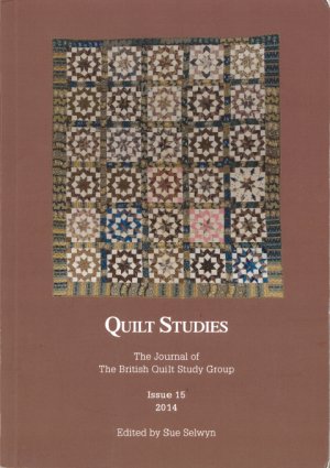 Booklet with traditional quilt on brown background