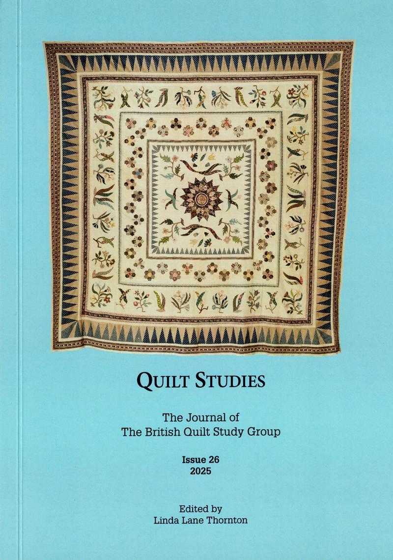 Elaborate frame quilt on light blue background