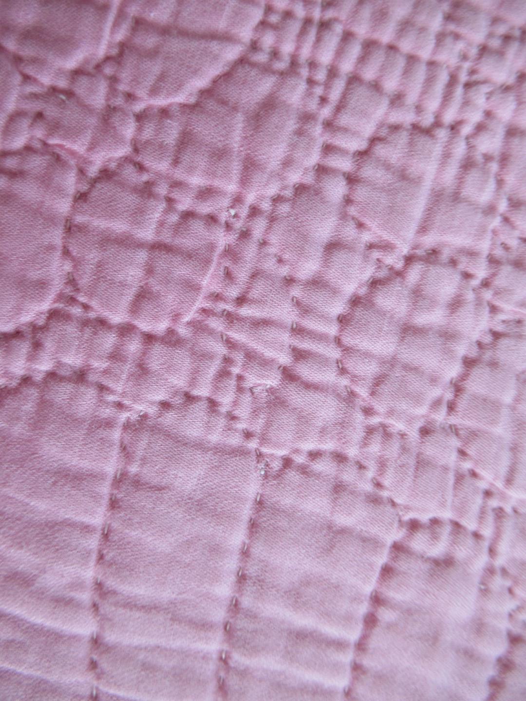 Pink quilt stitch detail