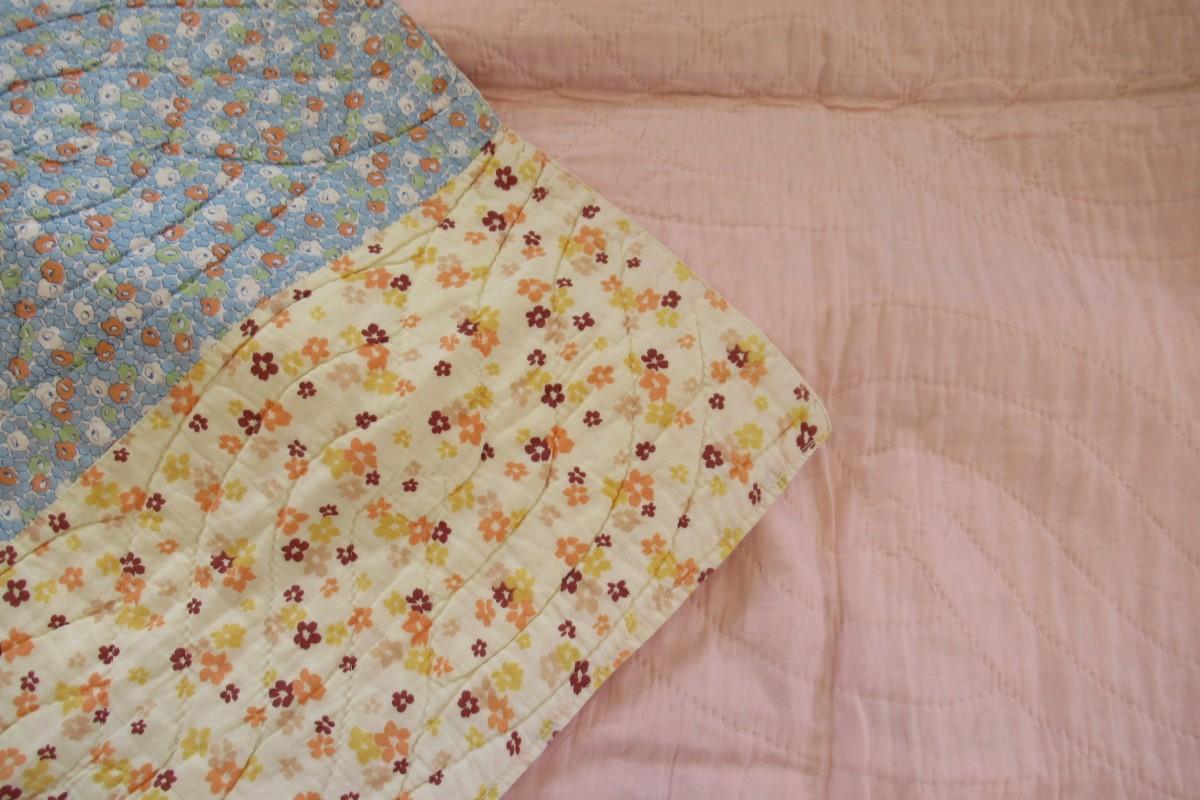 Strippy quilt corner folded over to show back