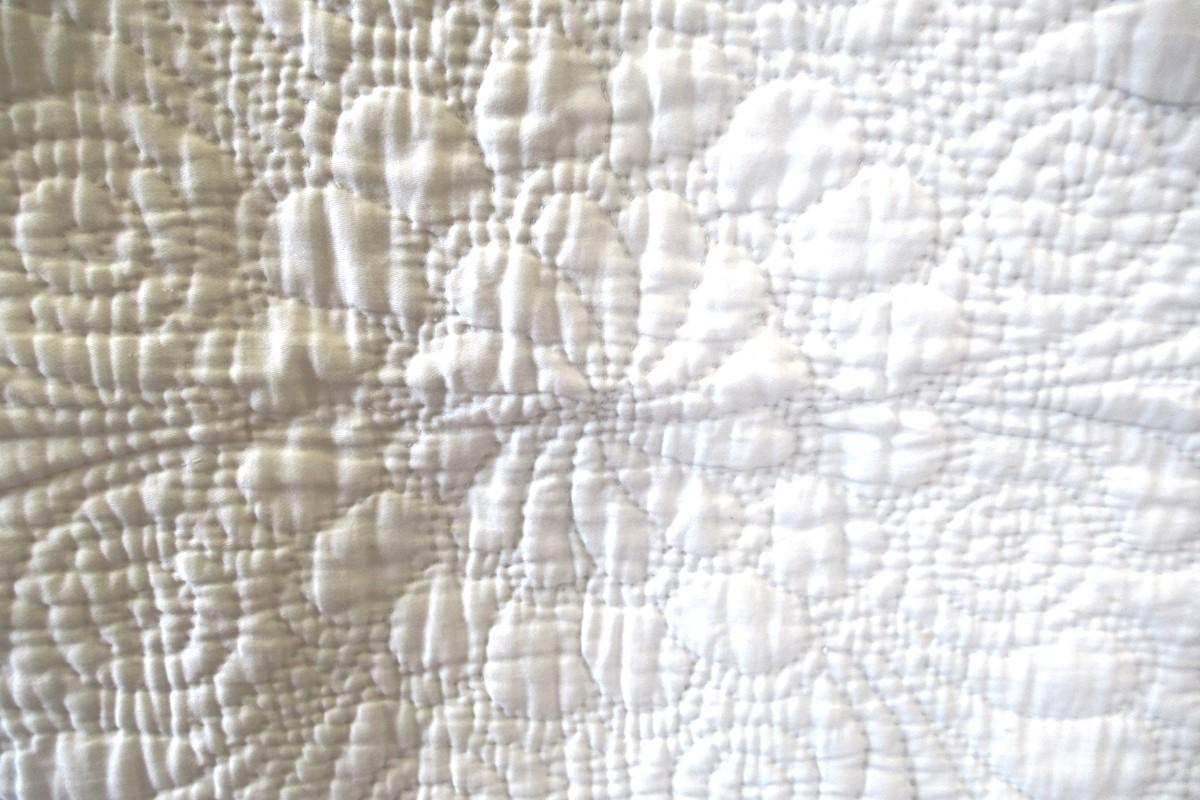 detail of white quilt, centre