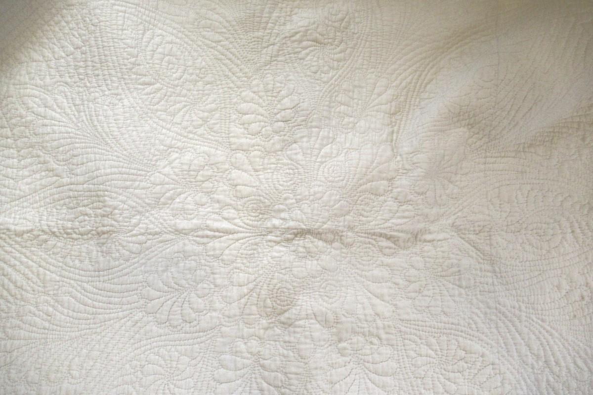White quilt detail of quilting, centre