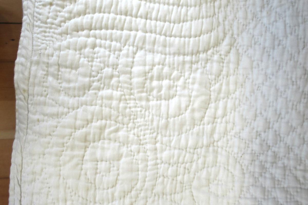 White quilt detail, edge