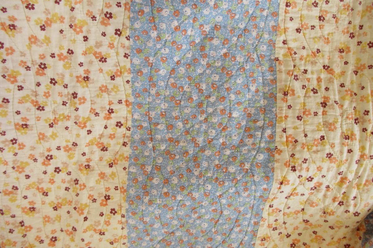 Blues and yellows strippy quilt detail