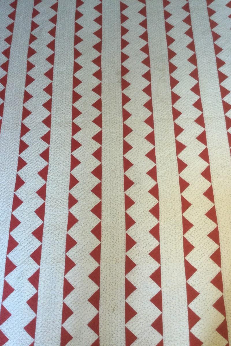 Red and print zig zag quilt