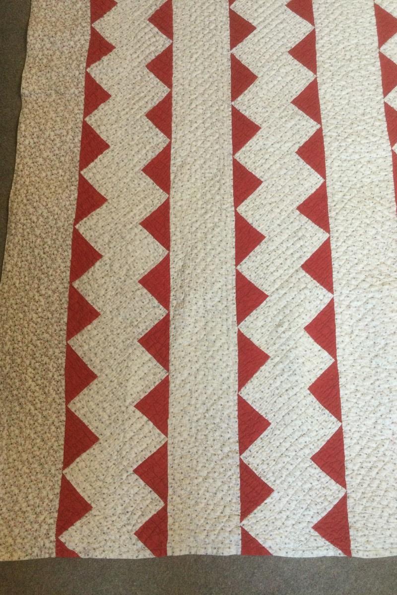 Red and print zig zag quilt
