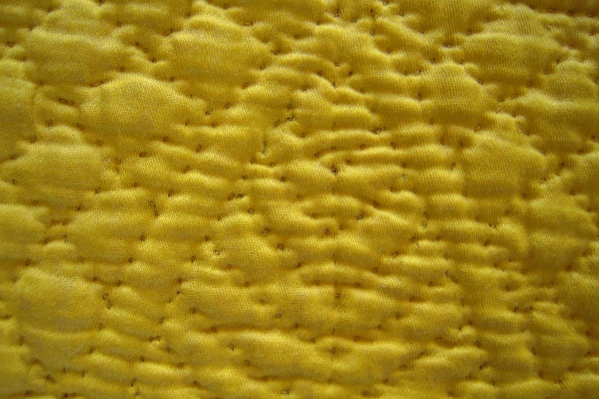 Detail of the quilting in yellow thread