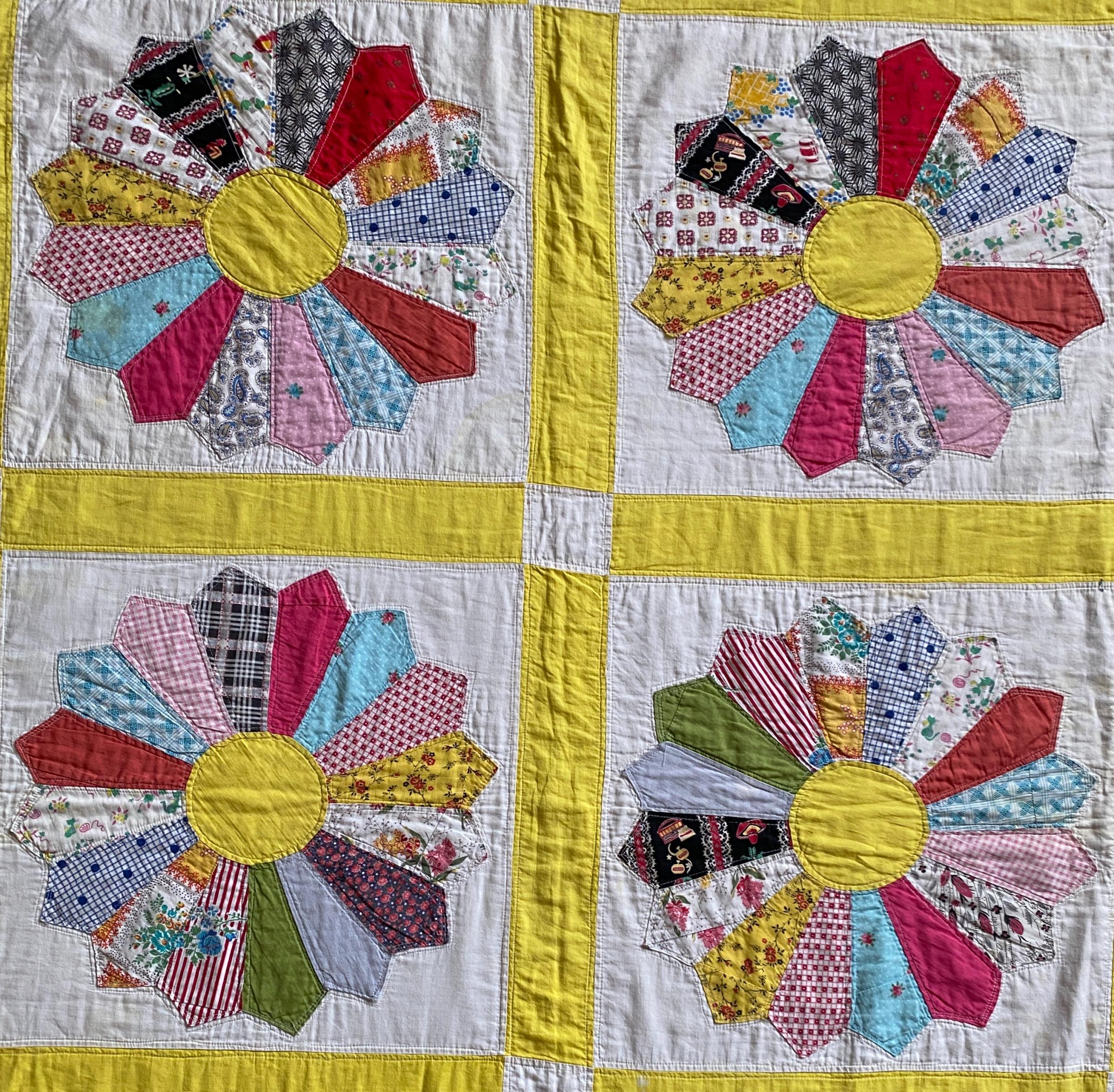 four blocks of Dresden plate quilt