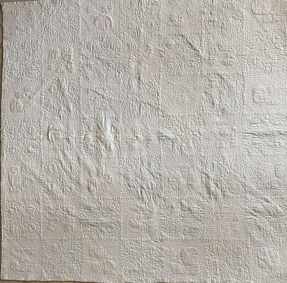 The whole reverse showing quilting patterns