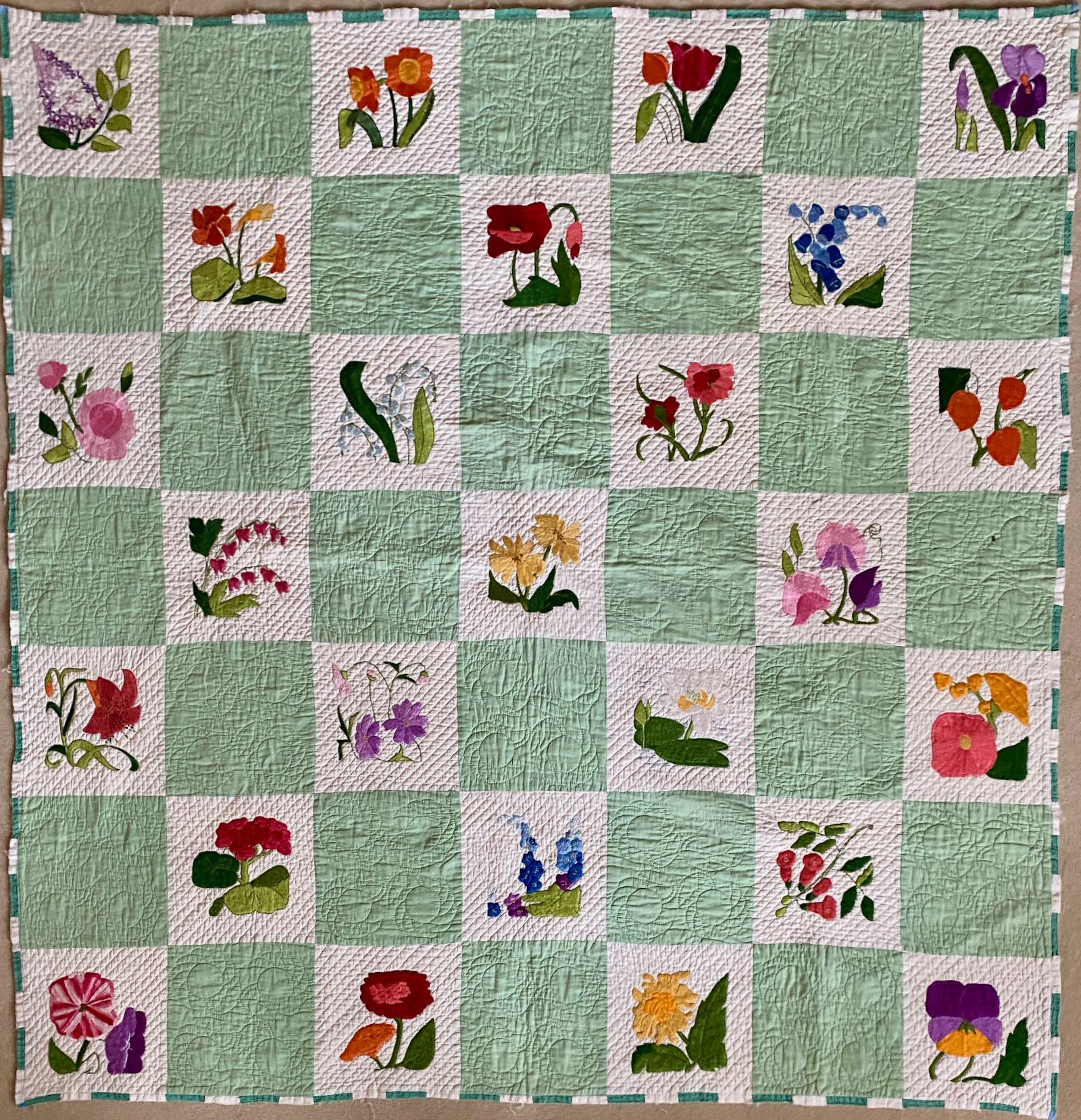  Embroidered flowers in a checkerboard - whole quilt
