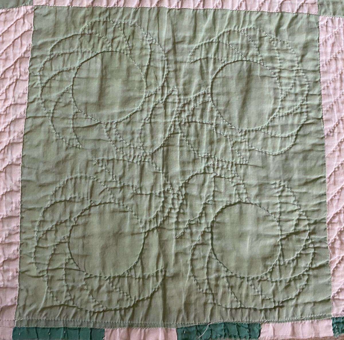 Detail of the quilting on green squares