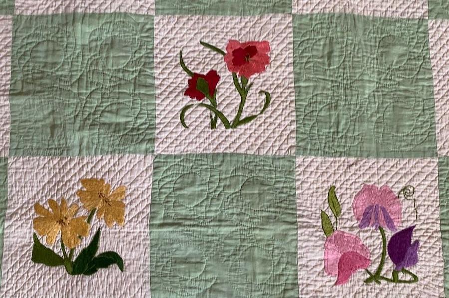 Detail of three of the embroideries