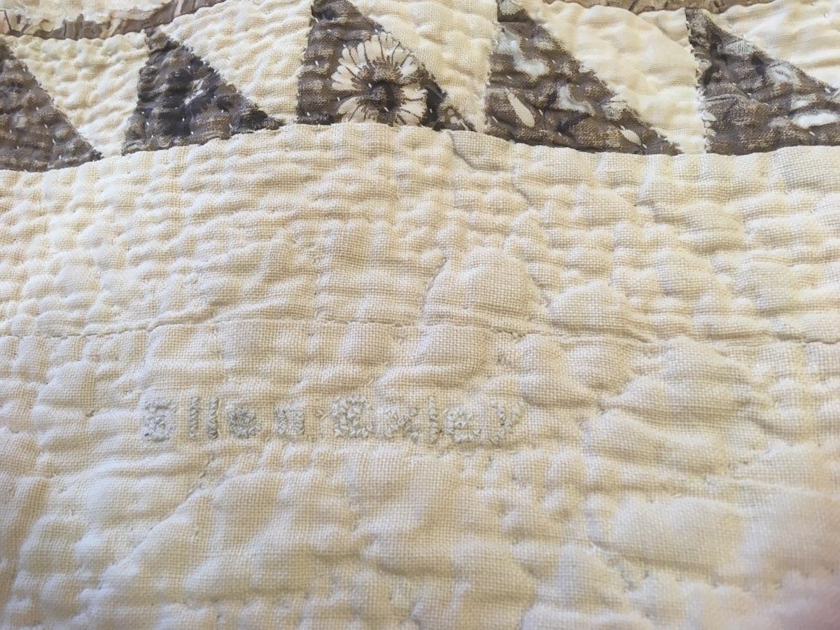 Pale blue stitched name "Ellen Oxley"