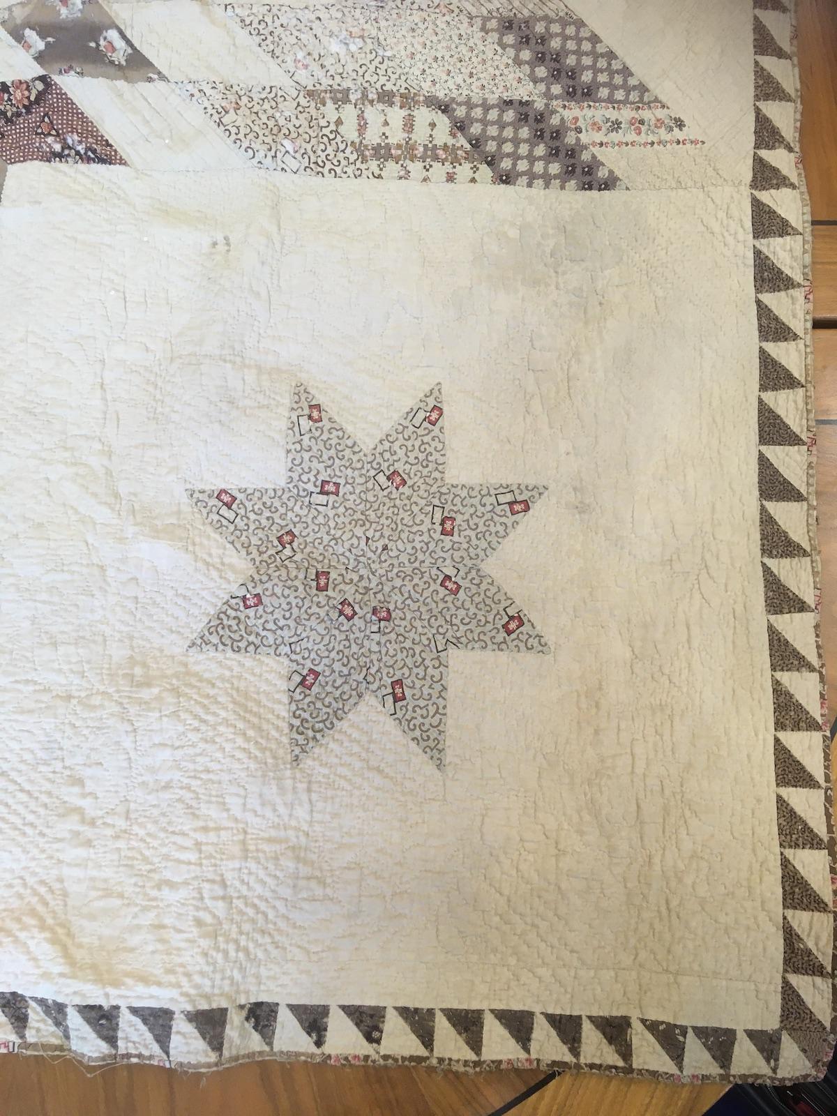 Patchwork star in grey and red fabrics