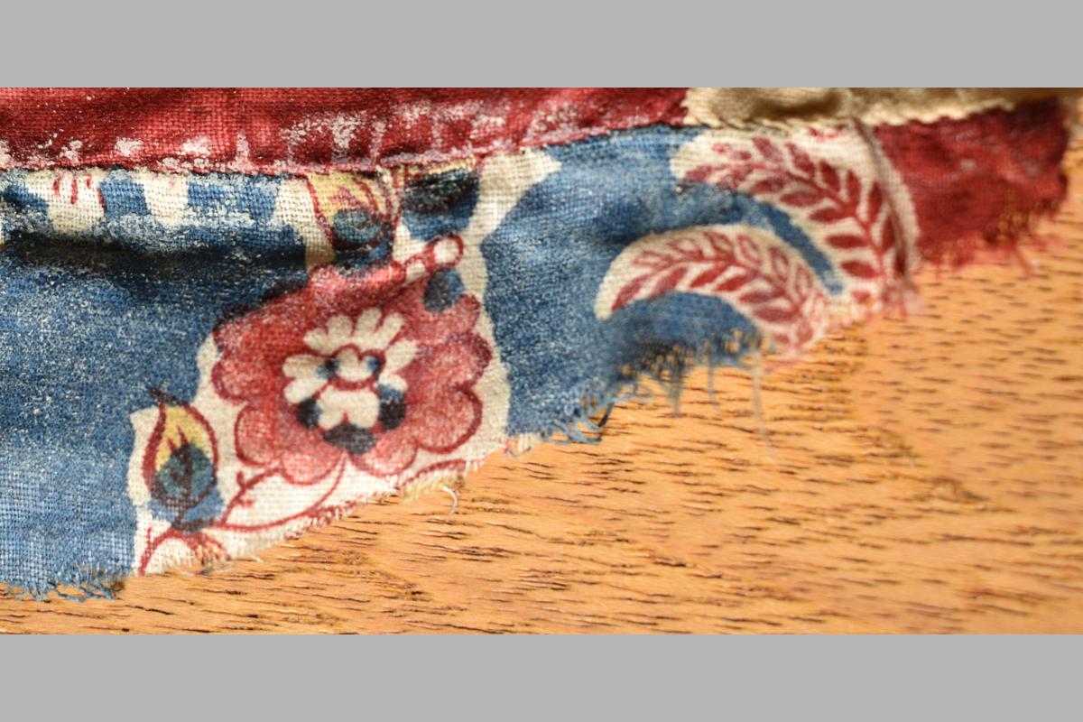 Fabric showing sections of both blue and red print