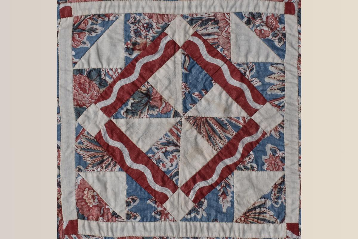 Blue patchwork with red strips in diamond