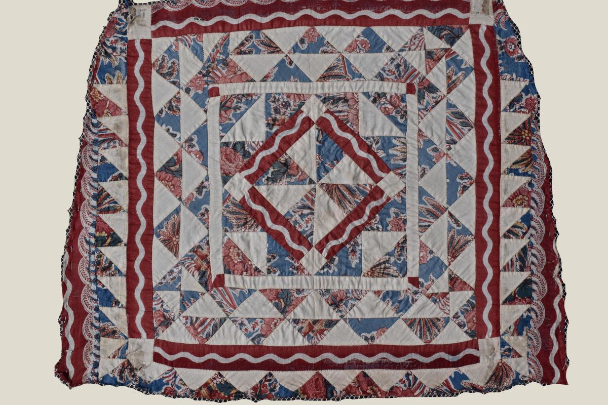 Trapezoidal shaped patchwork in blue, red and cream