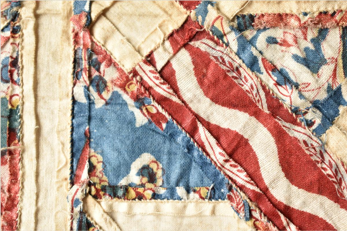 Back of patchwork showing oversewing stitches