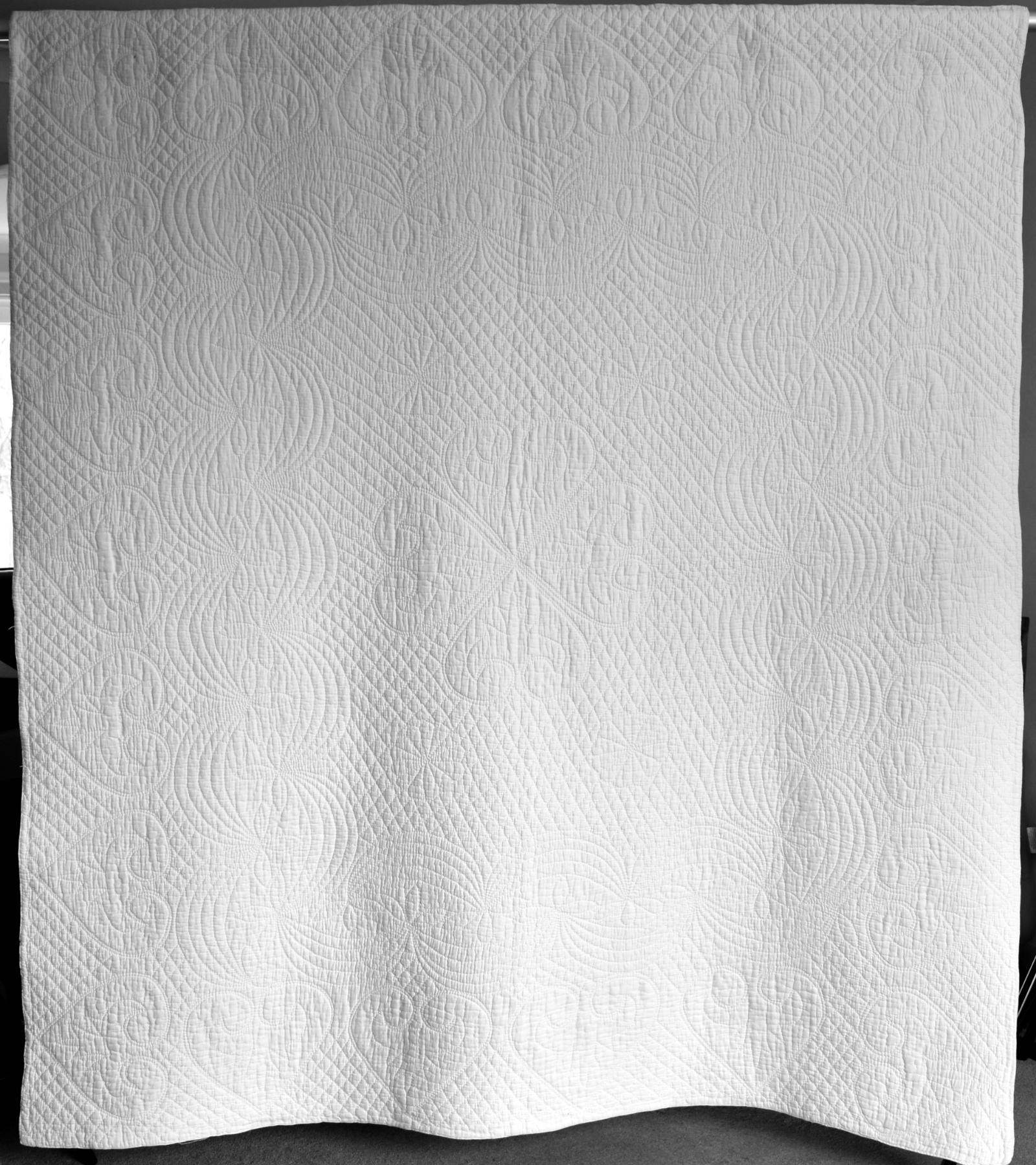 White quilt with stitched design