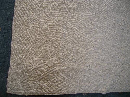 Close up image showing corner design of quilt