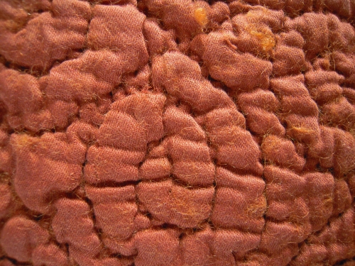 close up of stitching and bearded wadding
