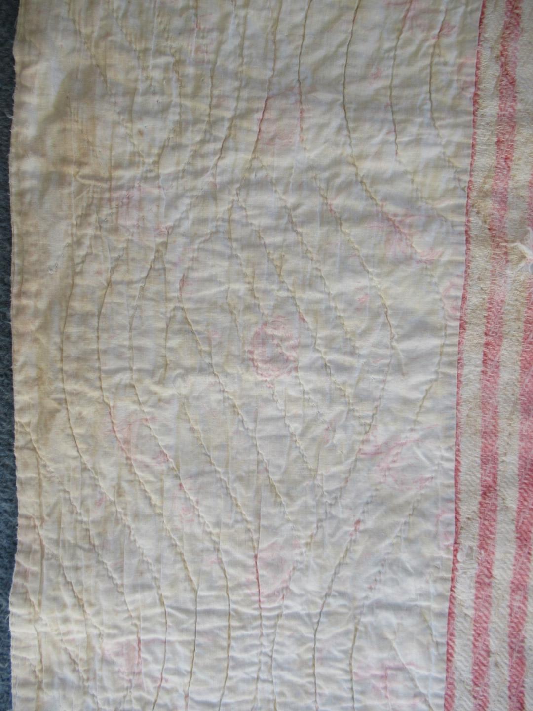 Outer off white border showing the quilting pattern