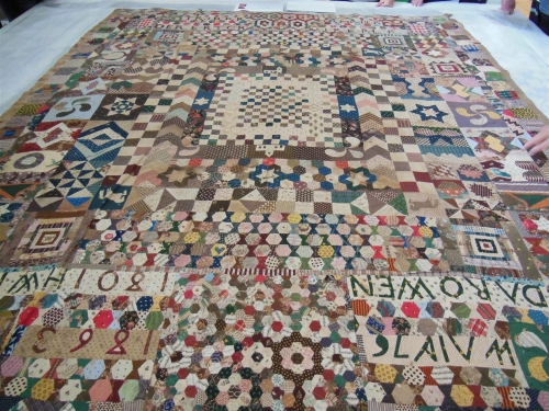 Patchwork quilt of many pieces, shapes and colours