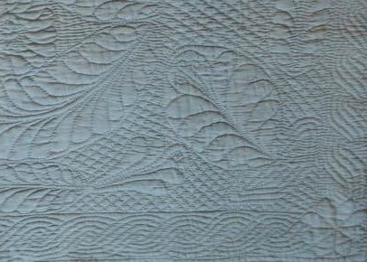 Pale blue quilted cot quilt