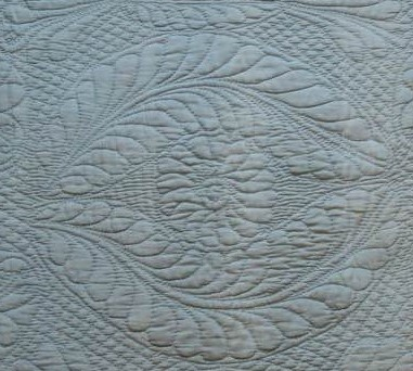 Pale blue quilted cot quilt
