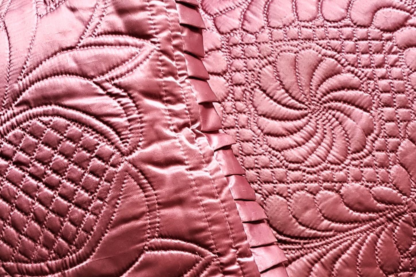 Pink satin cushions with quilting motifs