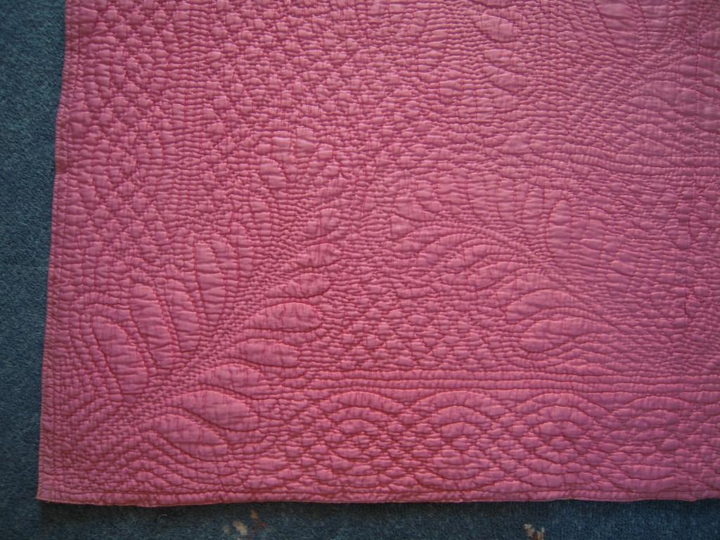 corner of a pink quilt