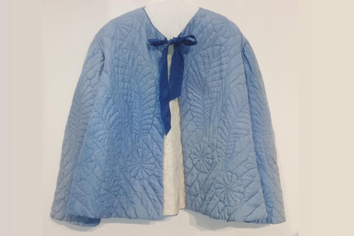 Blue quilted Bed Jacket with feathers, flowers and diagonal lines