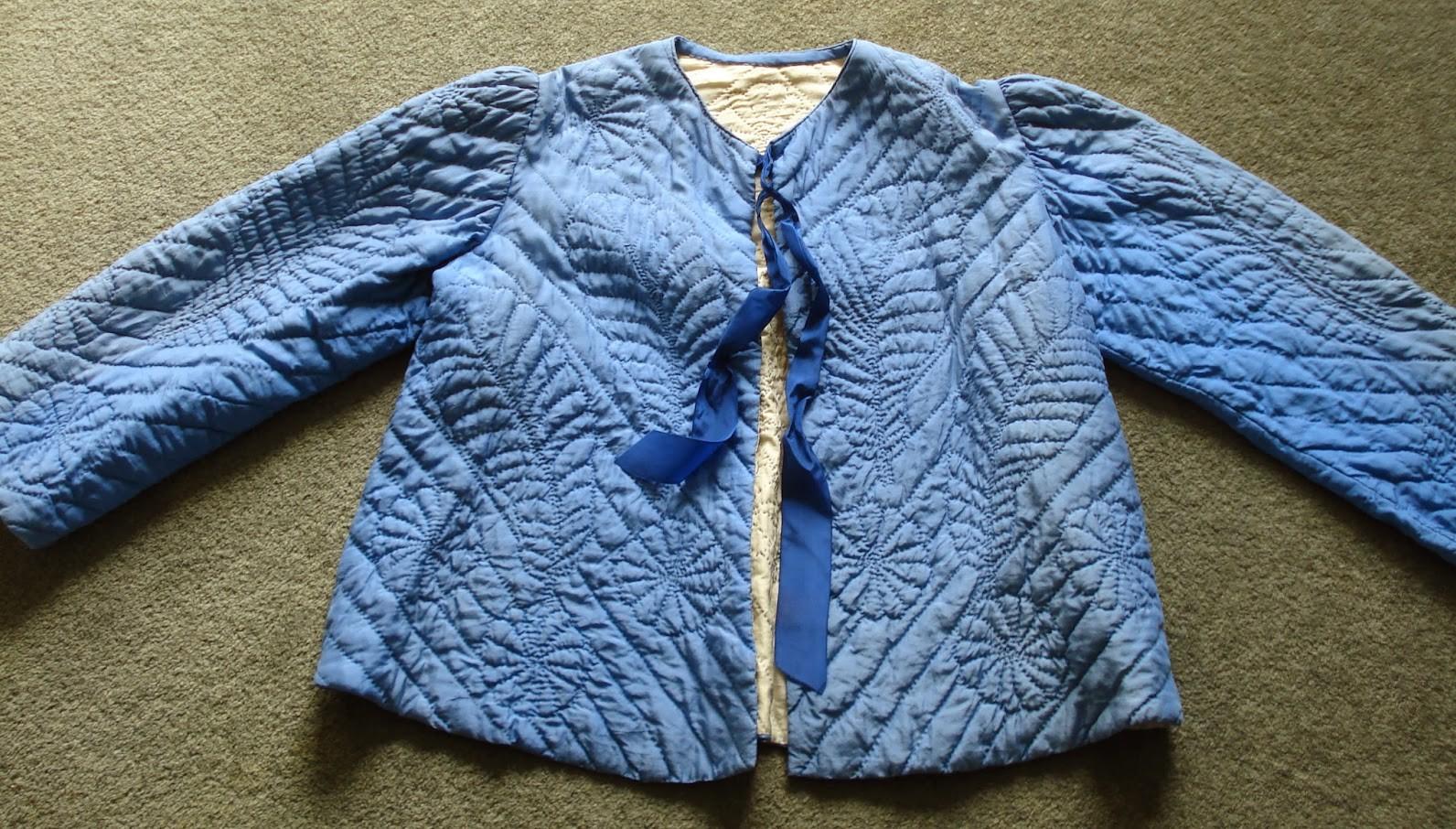 Blue quilted Bed Jacket with feathers, flowers and diagonal lines