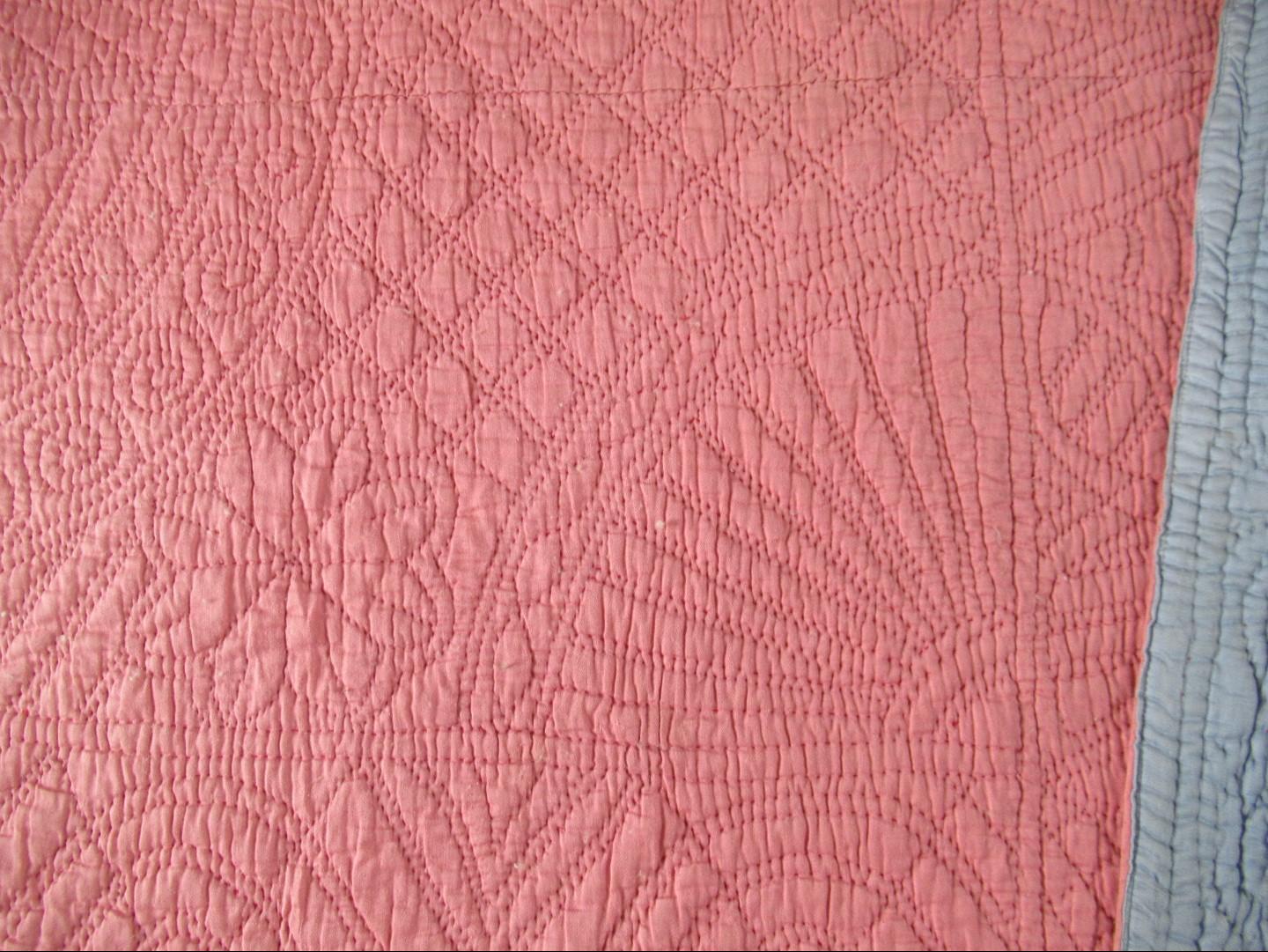 Pink quilt detail of fan design