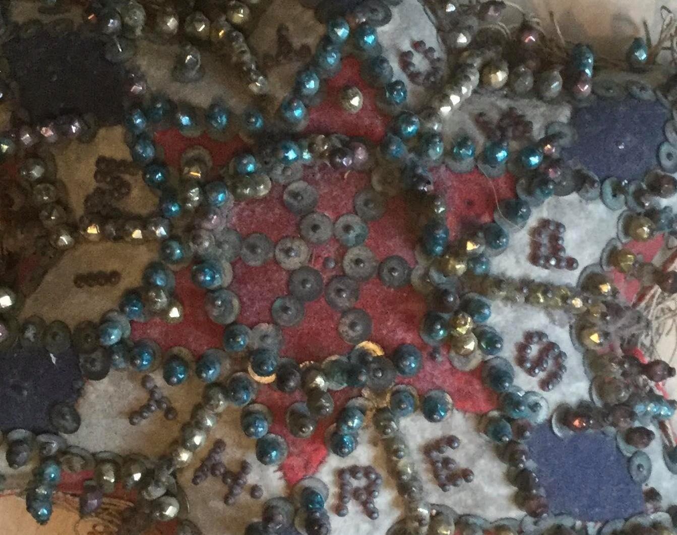 Red, white and blue patches with pins and sequins