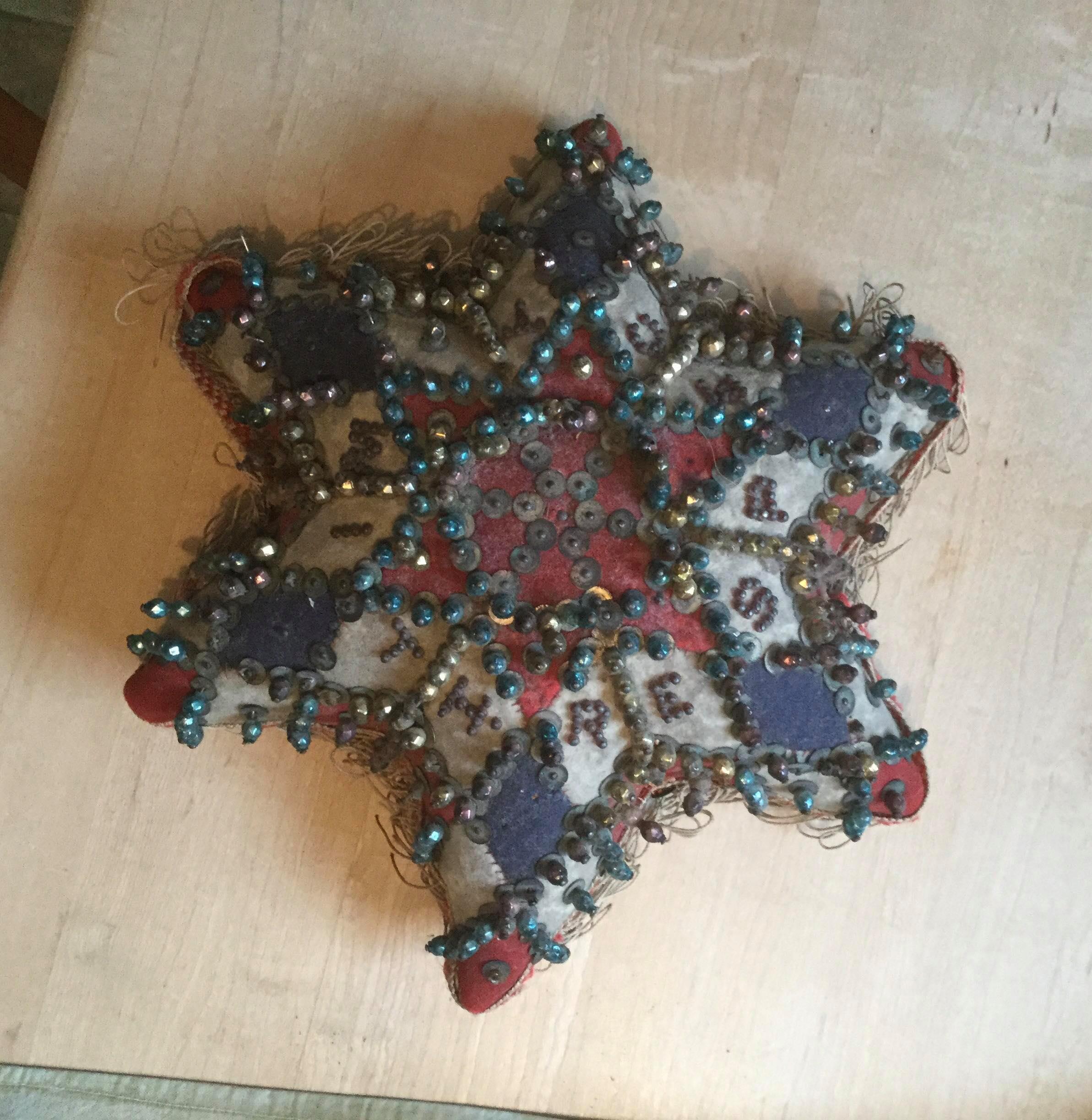 Star shape pincushion blue, red and white patches
